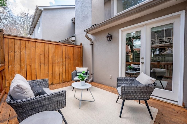 view of patio featuring a deck and french doors