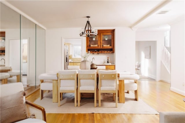 interior space with light hardwood / wood-style flooring and a chandelier