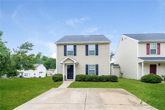 view of front of property with a front lawn