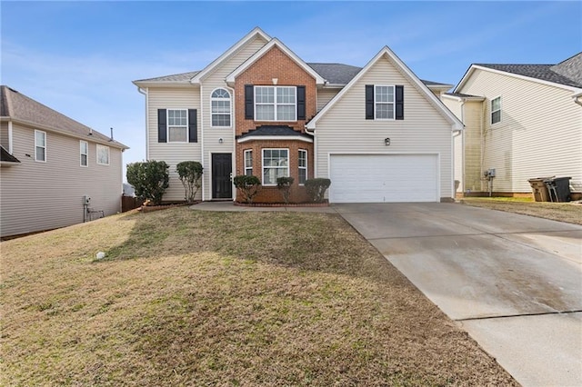 view of front property with a garage and a front yard