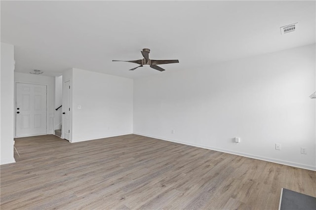 spare room featuring ceiling fan and light hardwood / wood-style floors