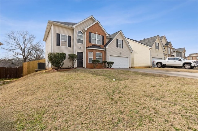 front facade with a garage and a front lawn