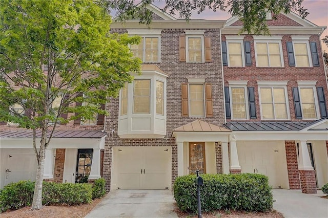 1160 Newpark View Pl Unit 8, Mableton, GA 30126 - townhome / multi-family property with brick siding, a standing seam roof, and concrete driveway