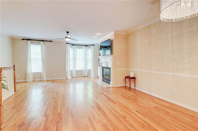 1160 Newpark View Pl Unit 8, Mableton, GA 30126 - unfurnished living room featuring wood finished floors, a fireplace with flush hearth, a ceiling fan, a chandelier, and ornamental molding