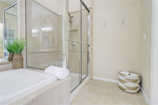 1160 Newpark View Pl Unit 8, Mableton, GA 30126 - bathroom featuring a stall shower, a garden tub, and tile patterned flooring
