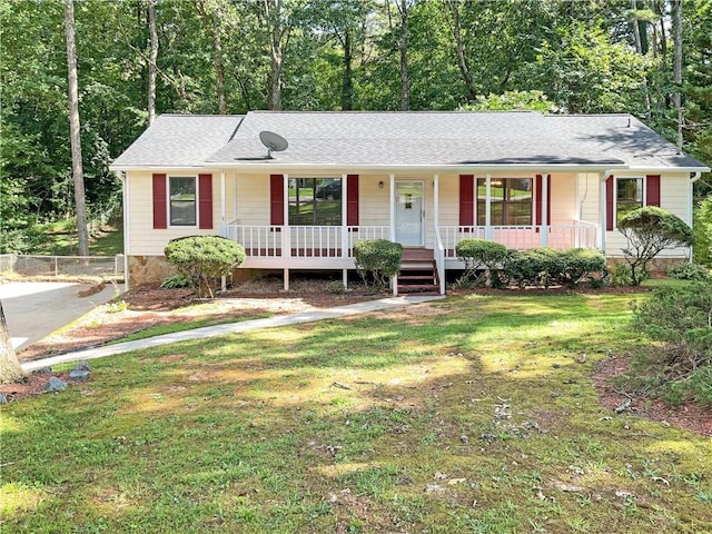 single story home with a porch and a front yard