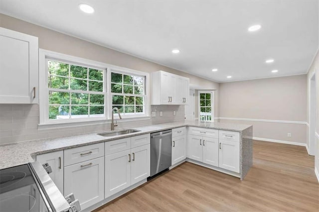 1420 Fieldgreen Overlook, Stone Mountain, GA 30088 - kitchen featuring dishwasher, a peninsula, white cabinetry, light wood-type flooring, and recessed lighting