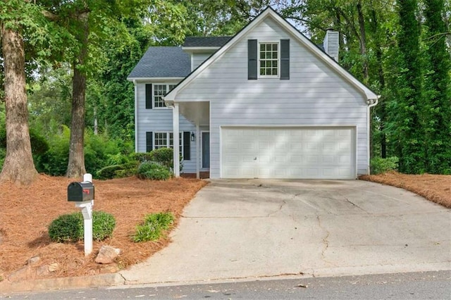1420 Fieldgreen Overlook, Stone Mountain, GA 30088 - traditional-style house featuring concrete driveway and a chimney