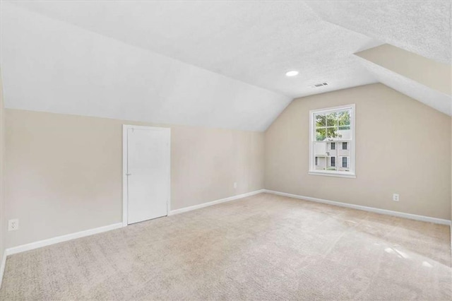 1420 Fieldgreen Overlook, Stone Mountain, GA 30088 - additional living space with carpet and vaulted ceiling