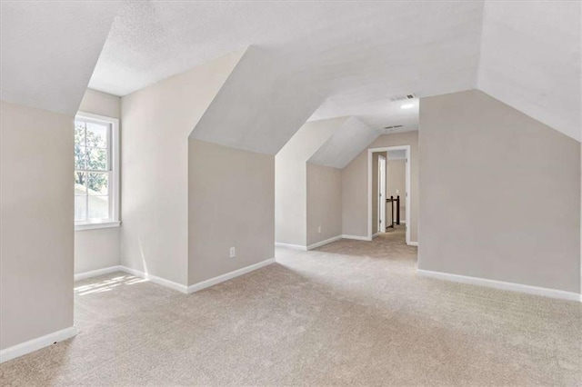 1420 Fieldgreen Overlook, Stone Mountain, GA 30088 - additional living space with carpet flooring and lofted ceiling