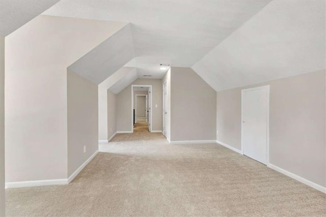 1420 Fieldgreen Overlook, Stone Mountain, GA 30088 - bonus room featuring light carpet and vaulted ceiling