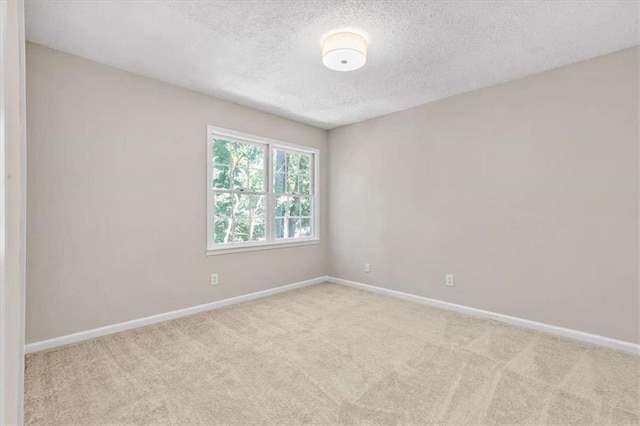 1420 Fieldgreen Overlook, Stone Mountain, GA 30088 - carpeted empty room with a textured ceiling and baseboards