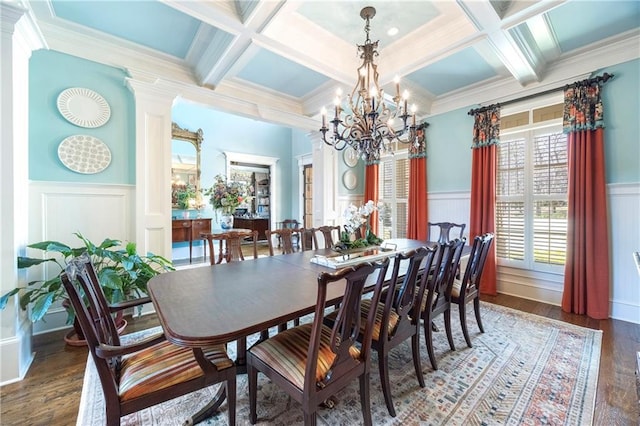 dining room featuring beam ceiling, coffered ceiling, wood finished floors, and ornate columns