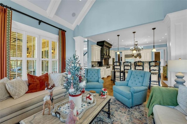 living room featuring vaulted ceiling with beams, a notable chandelier, wood-type flooring, and ornamental molding