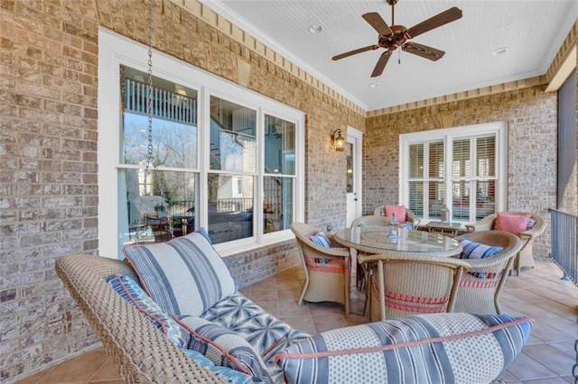 exterior space with outdoor dining area and a ceiling fan