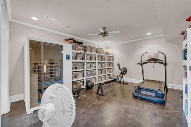 exercise room featuring ceiling fan and ornamental molding