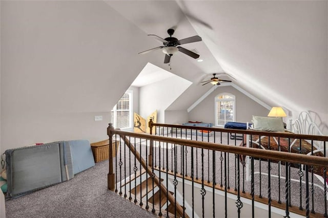 bonus room featuring carpet floors, vaulted ceiling, and ceiling fan