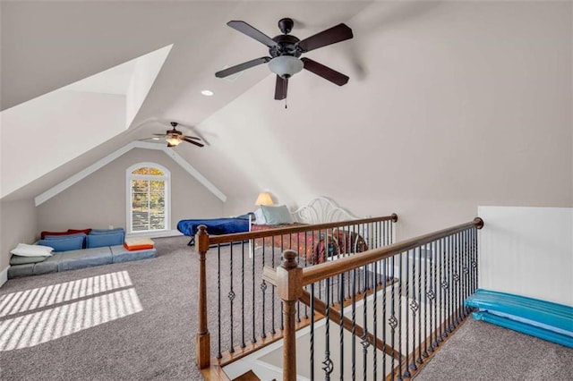 additional living space with carpet flooring, ceiling fan, and lofted ceiling