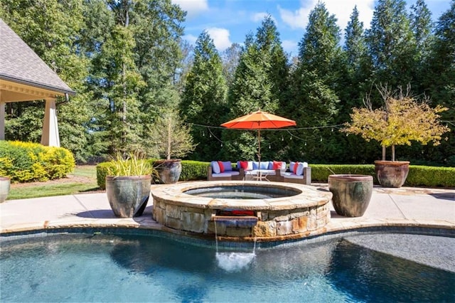 view of swimming pool featuring outdoor lounge area, a patio area, and an in ground hot tub