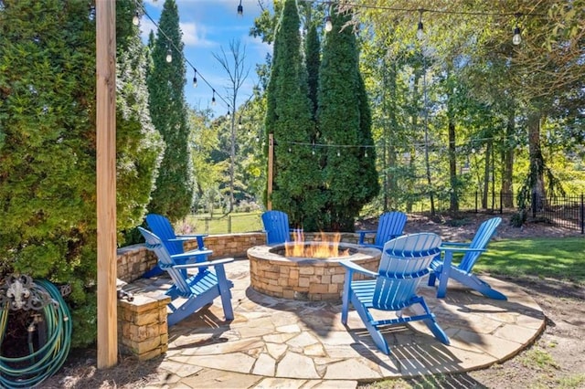 view of patio / terrace with an outdoor fire pit