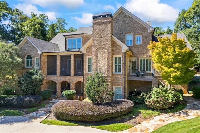 view of front of property featuring a sunroom