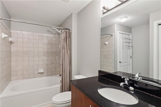 full bathroom featuring toilet, shower / tub combo, and vanity