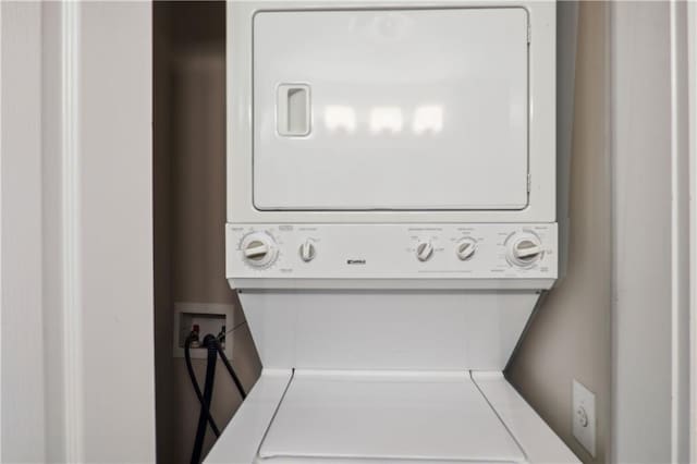 laundry room featuring stacked washing maching and dryer