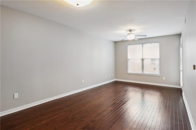 unfurnished room featuring ceiling fan and dark hardwood / wood-style flooring