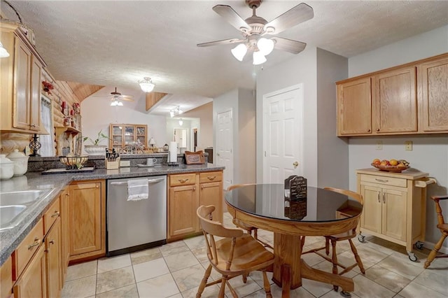 kitchen with sink, stainless steel dishwasher, ceiling fan, kitchen peninsula, and a textured ceiling