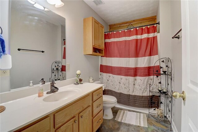 bathroom with vanity, a shower with shower curtain, and toilet