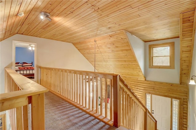 corridor featuring carpet, high vaulted ceiling, and wood ceiling