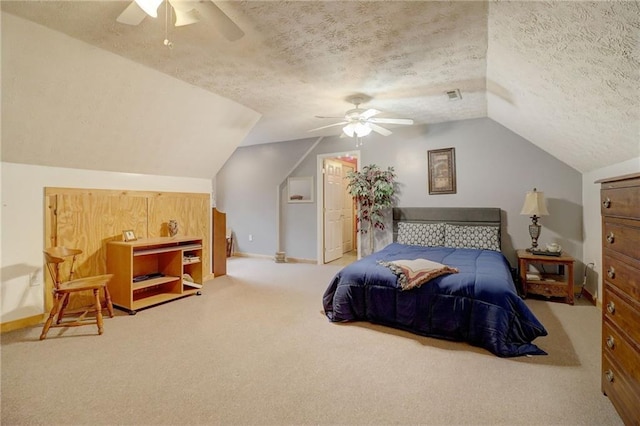 carpeted bedroom featuring ceiling fan, vaulted ceiling, and a textured ceiling