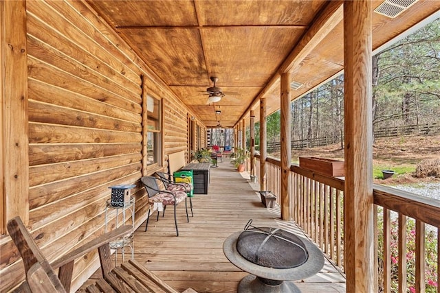 wooden deck with ceiling fan and covered porch