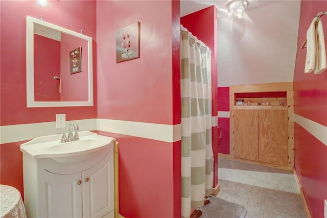 bathroom with tile patterned floors and vanity