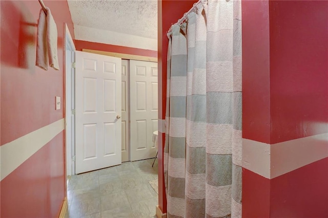 bathroom with a textured ceiling