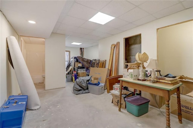 basement featuring a paneled ceiling