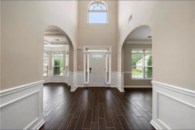 foyer featuring ornamental molding