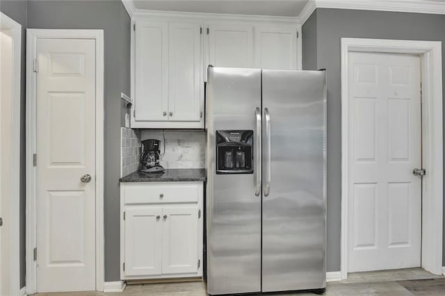 5407 Palmetto Ct, Flowery Branch, GA 30542 - kitchen featuring stainless steel fridge with ice dispenser, white cabinetry, dark stone counters, decorative backsplash, and light wood-style floors