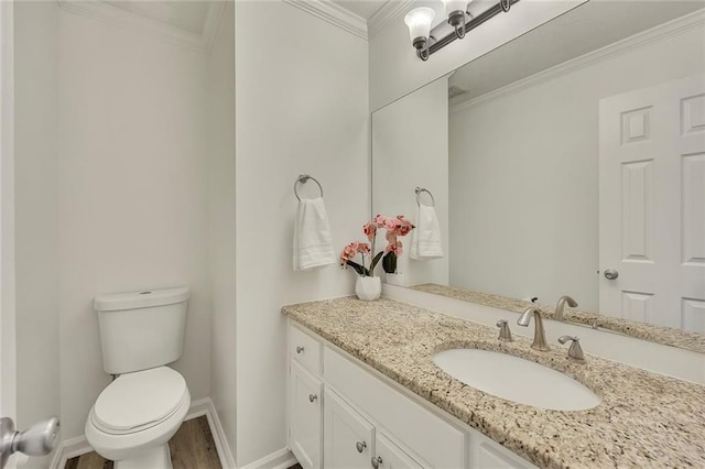 5407 Palmetto Ct, Flowery Branch, GA 30542 - half bath with vanity, toilet, baseboards, wood finished floors, and crown molding