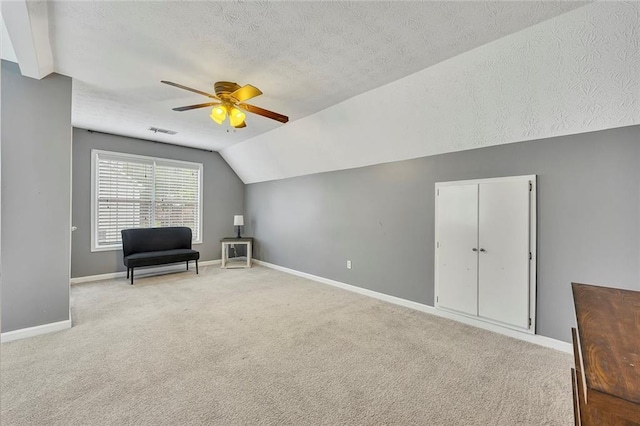 5407 Palmetto Ct, Flowery Branch, GA 30542 - additional living space with a textured ceiling, lofted ceiling, carpet, a ceiling fan, and baseboards