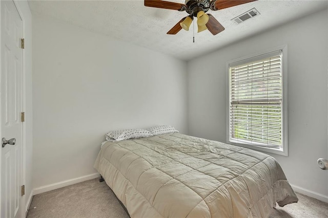 5407 Palmetto Ct, Flowery Branch, GA 30542 - carpeted bedroom featuring baseboards, a textured ceiling, and a ceiling fan