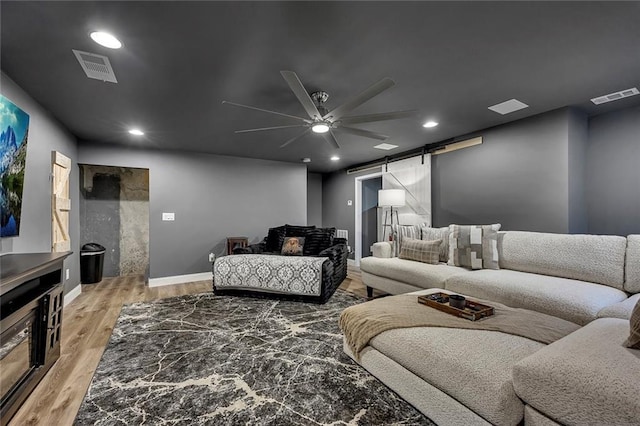 5407 Palmetto Ct, Flowery Branch, GA 30542 - living room featuring a barn door, wood finished floors, a ceiling fan, baseboards, and recessed lighting