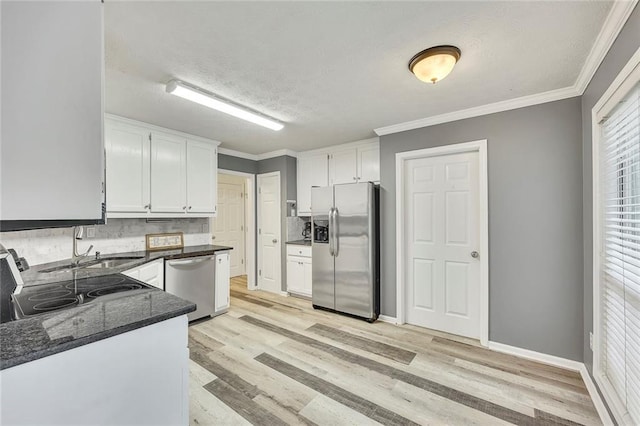 5407 Palmetto Ct, Flowery Branch, GA 30542 - kitchen with stainless steel appliances, white cabinetry, light wood-type flooring, a textured ceiling, and backsplash