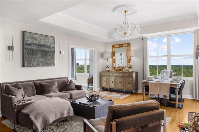 2881 Peachtree Rd NE Unit 1102, Atlanta, GA 30305 - living area featuring wood finished floors, a chandelier, baseboards, and crown molding