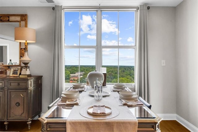 2881 Peachtree Rd NE Unit 1102, Atlanta, GA 30305 - dining space with dark wood-type flooring, healthy amount of natural light, and baseboards