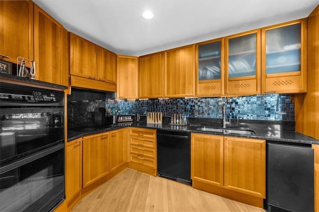2881 Peachtree Rd NE Unit 1102, Atlanta, GA 30305 - kitchen featuring a sink, black appliances, dark stone counters, decorative backsplash, and recessed lighting