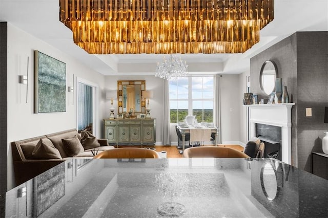 2881 Peachtree Rd NE Unit 1102, Atlanta, GA 30305 - living area with a chandelier, a fireplace, and a raised ceiling