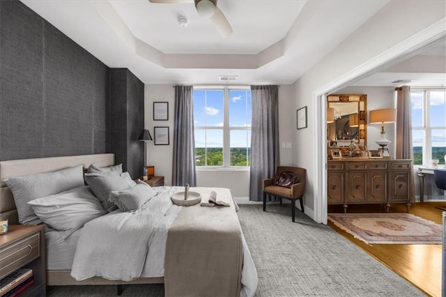 2881 Peachtree Rd NE Unit 1102, Atlanta, GA 30305 - bedroom featuring multiple windows, light wood-style floors, baseboards, and an accent wall