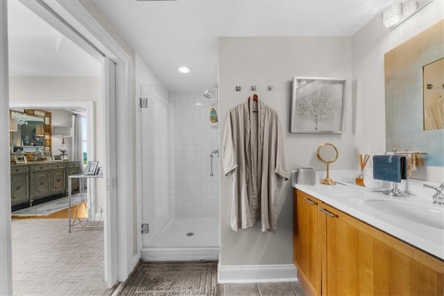 2881 Peachtree Rd NE Unit 1102, Atlanta, GA 30305 - full bath featuring a stall shower, baseboards, vanity, and tile patterned floors