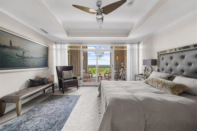2881 Peachtree Rd NE Unit 1102, Atlanta, GA 30305 - bedroom with carpet flooring, access to exterior, ornamental molding, a raised ceiling, and a chandelier